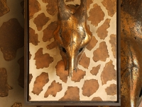 wall-panel-with-giraffe-skull-in-metalic-antique-gold